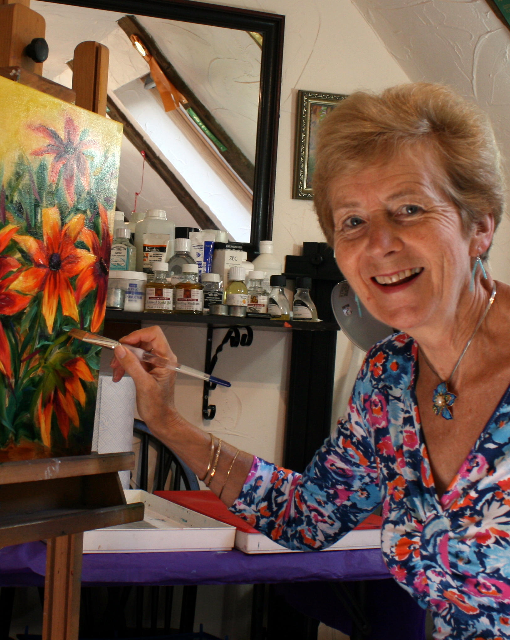 Marion Derrett painting in her studio